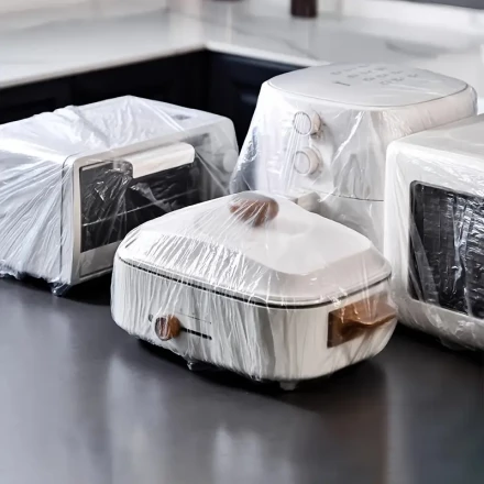 Ten Compact Devices, Including Microwave Ovens, Rice Cookers, And Vacuum Cleaners, Along with Disposable Dust Covers Made of Clear Plastic for Organizing And Cleaning Your Home Kitchen.